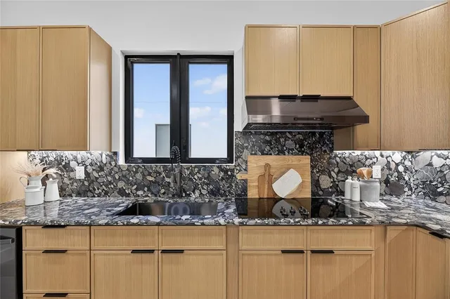 a view of kitchen with furniture and wooden floor