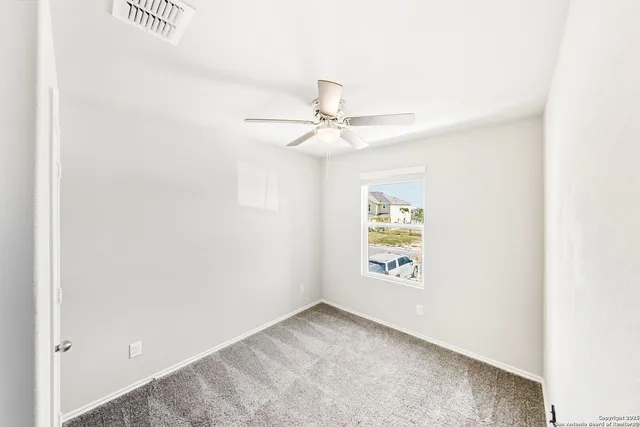 a bathroom with a granite countertop sink toilet tub and shower