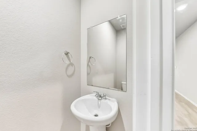 a view of backyard with deck and a garden