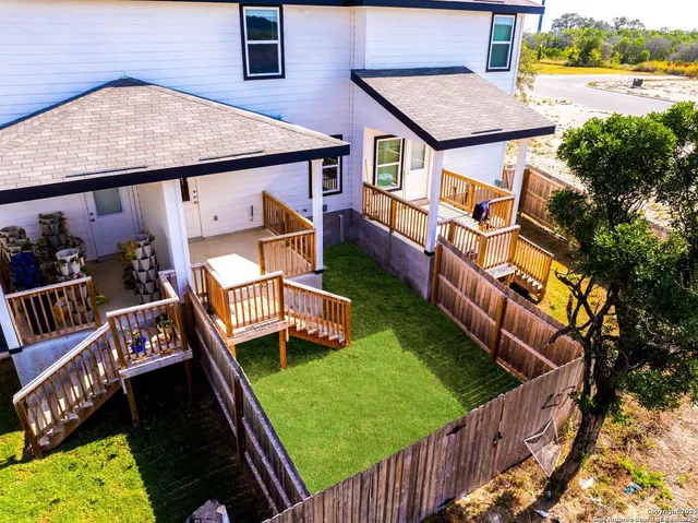 a picture of a bench in front of a wall