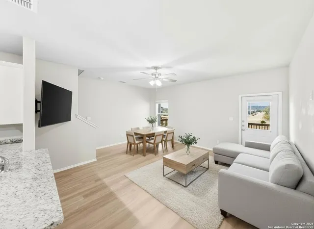 a kitchen with stainless steel appliances granite countertop a refrigerator stove microwave and sink