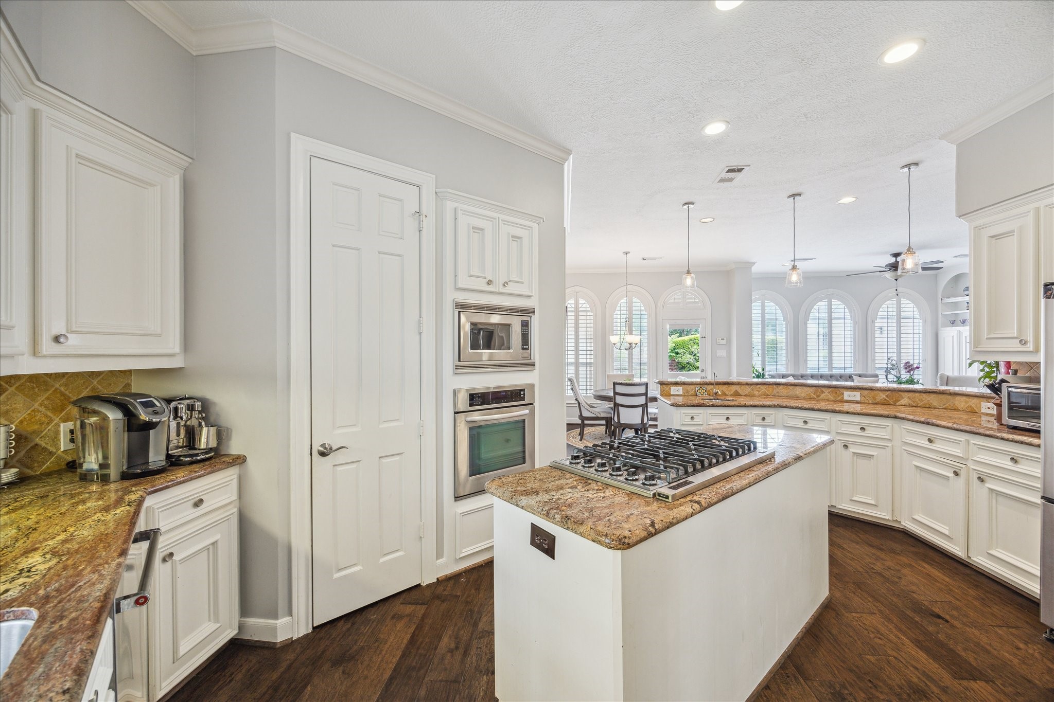 13627 Ashley Run Houston, TX 77077 - Photo 13 of 30 a kitchen with stainless steel appliances granite countertop a stove and a refrigerator