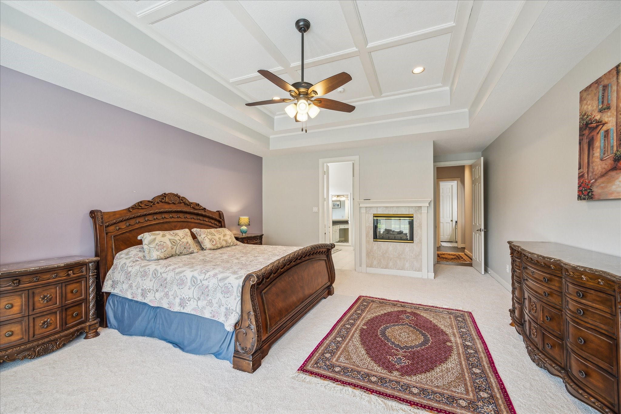 13627 Ashley Run Houston, TX 77077 - Photo 21 of 30 a bedroom with a bed and a chandelier