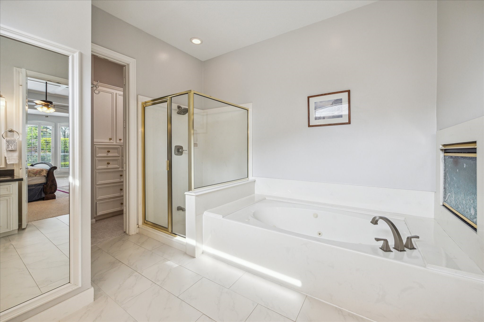 13627 Ashley Run Houston, TX 77077 - Photo 22 of 30 a bathroom with a bathtub and a shower