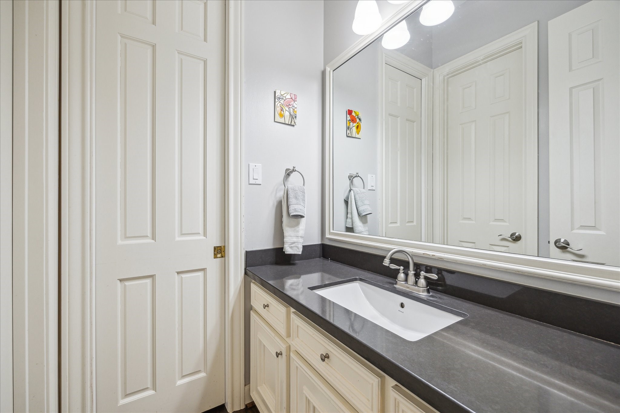 13627 Ashley Run Houston, TX 77077 - Photo 27 of 30 a bathroom with a double vanity sink and a mirror