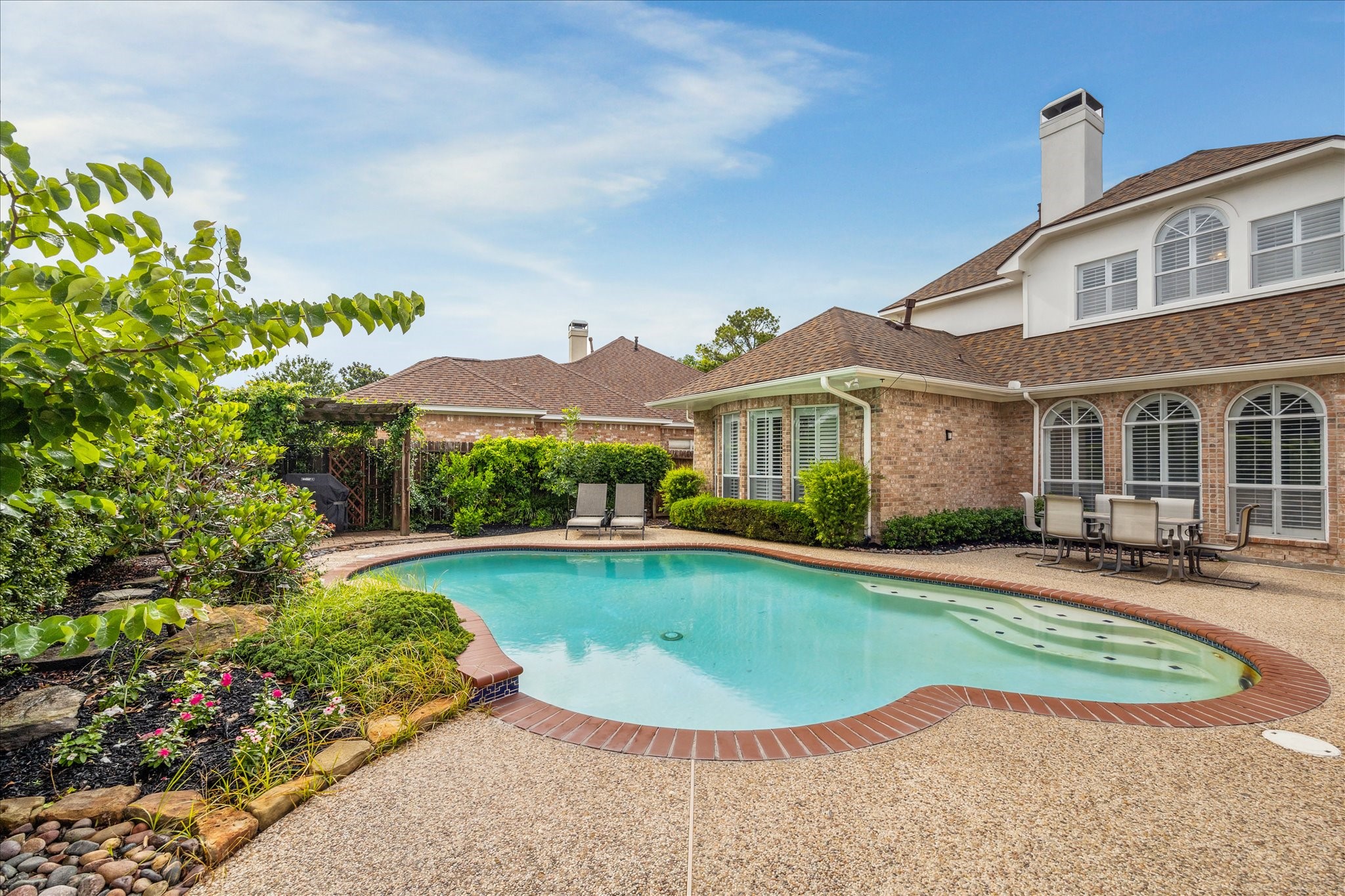 13627 Ashley Run Houston, TX 77077 - Photo 29 of 30 front view of a house with a swimming pool