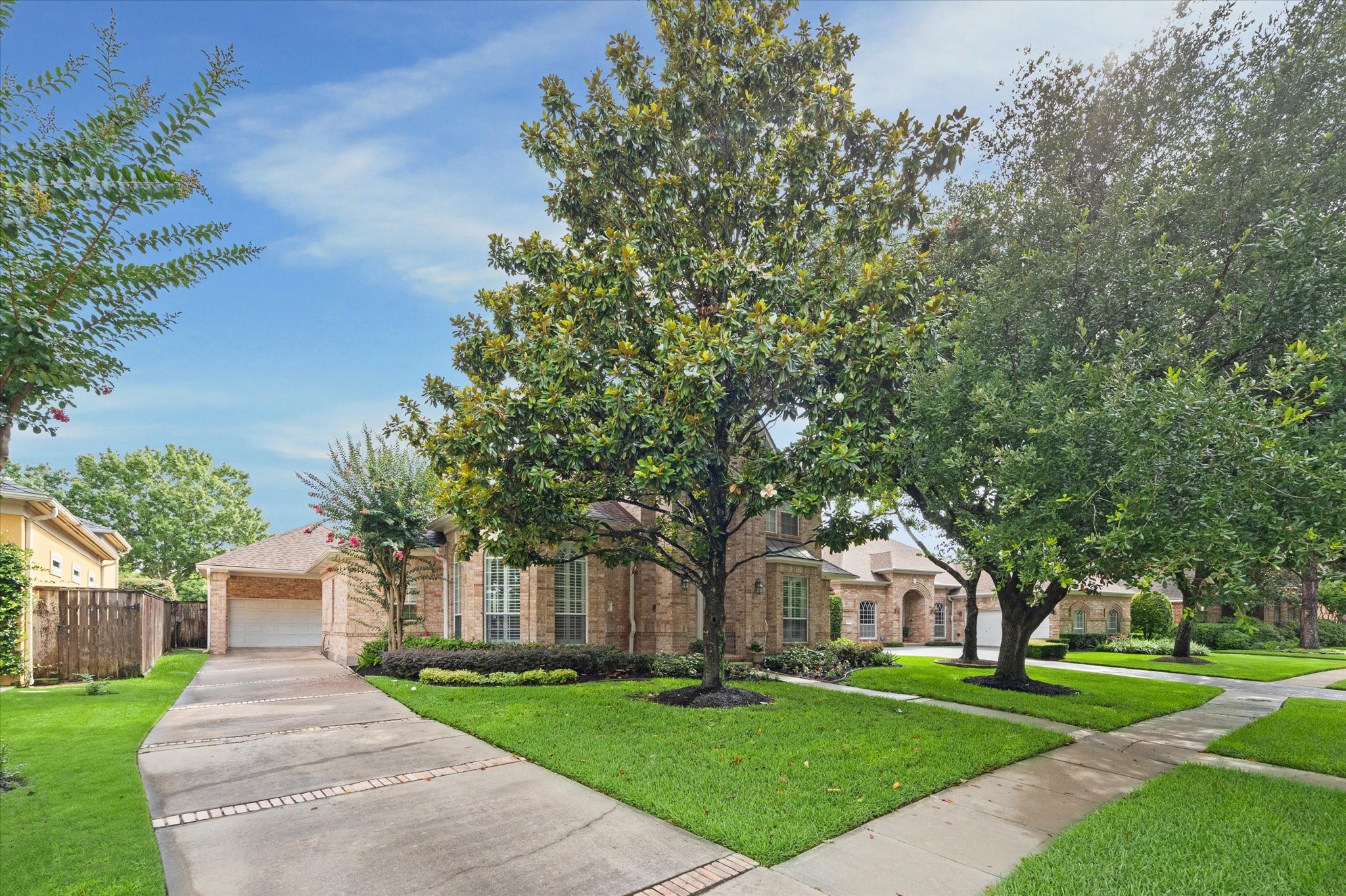13627 Ashley Run Houston, TX 77077 - Photo 3 of 30 a front view of a house with a yard