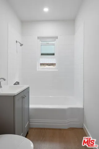 a bathroom with a sink and a bathtub