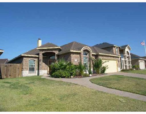 6542 Lens Drive Corpus Christi, TX 78414 - Photo 1 of 8 a front view of a house with a yard