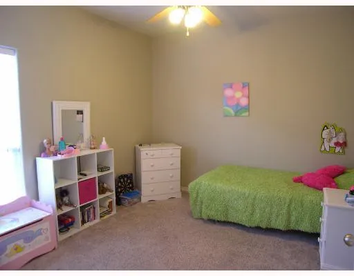 a room with toys and a wooden floor