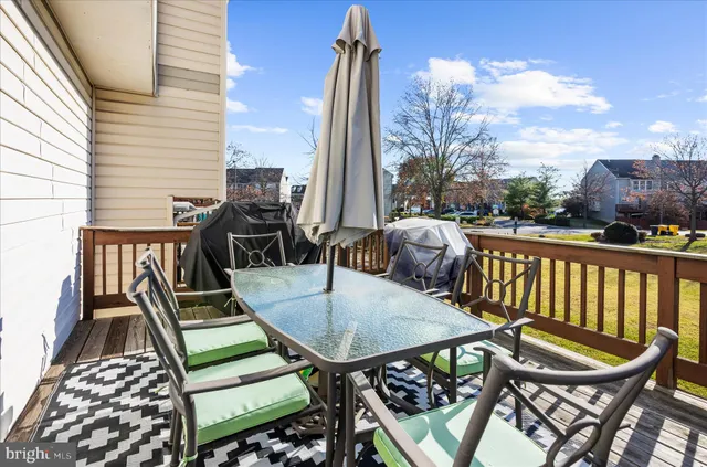 a view of a balcony with furniture