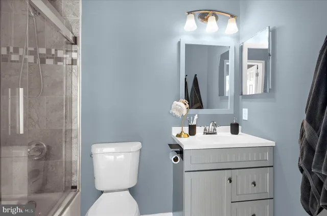 a bathroom with a shower and toilet