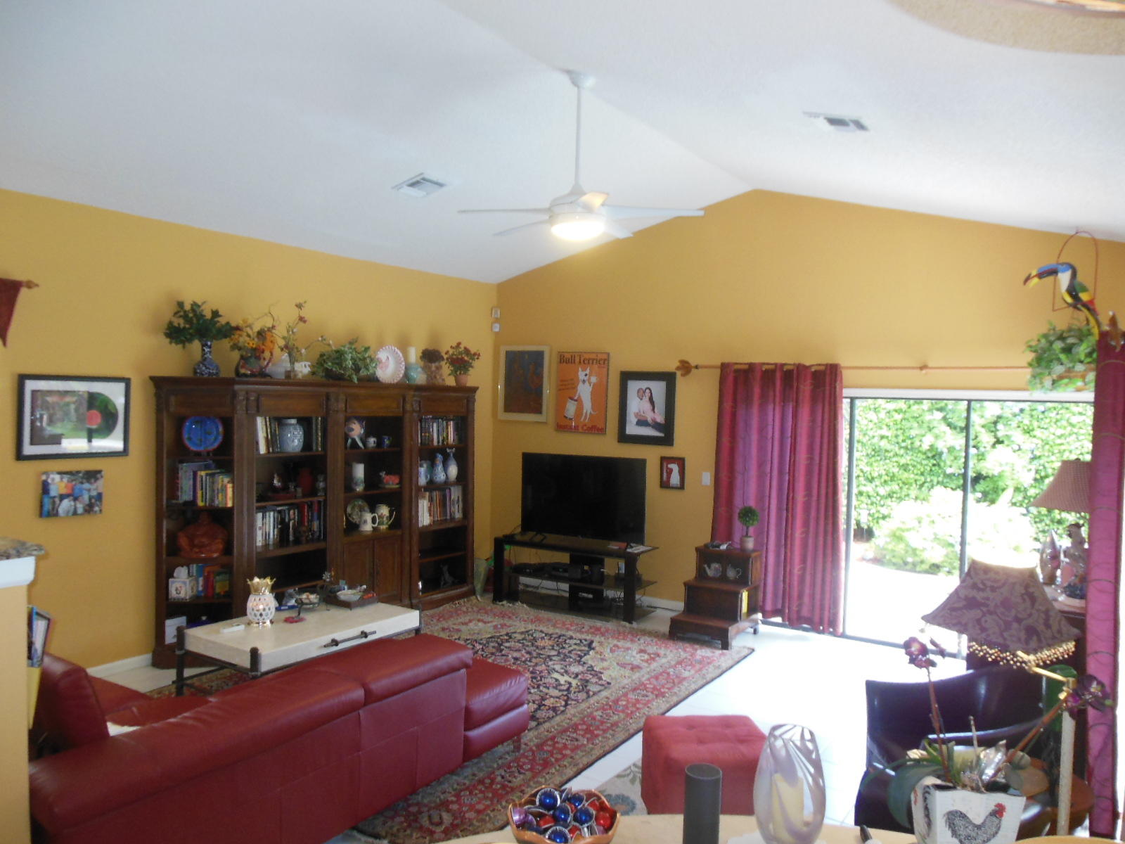 2653 Northwest 48th Street Boca Raton, FL 33434 - Photo 16 of 56 a living room with furniture a flat screen tv and a large window