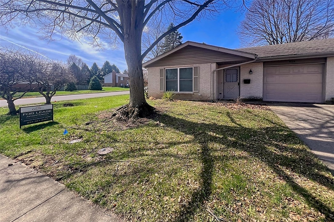 920 North Dorset Road, Unit 920 Troy, OH 45373 - Photo 1 of 18 This charming home offers a simple facade with an inviting entryway and an attached garage.
