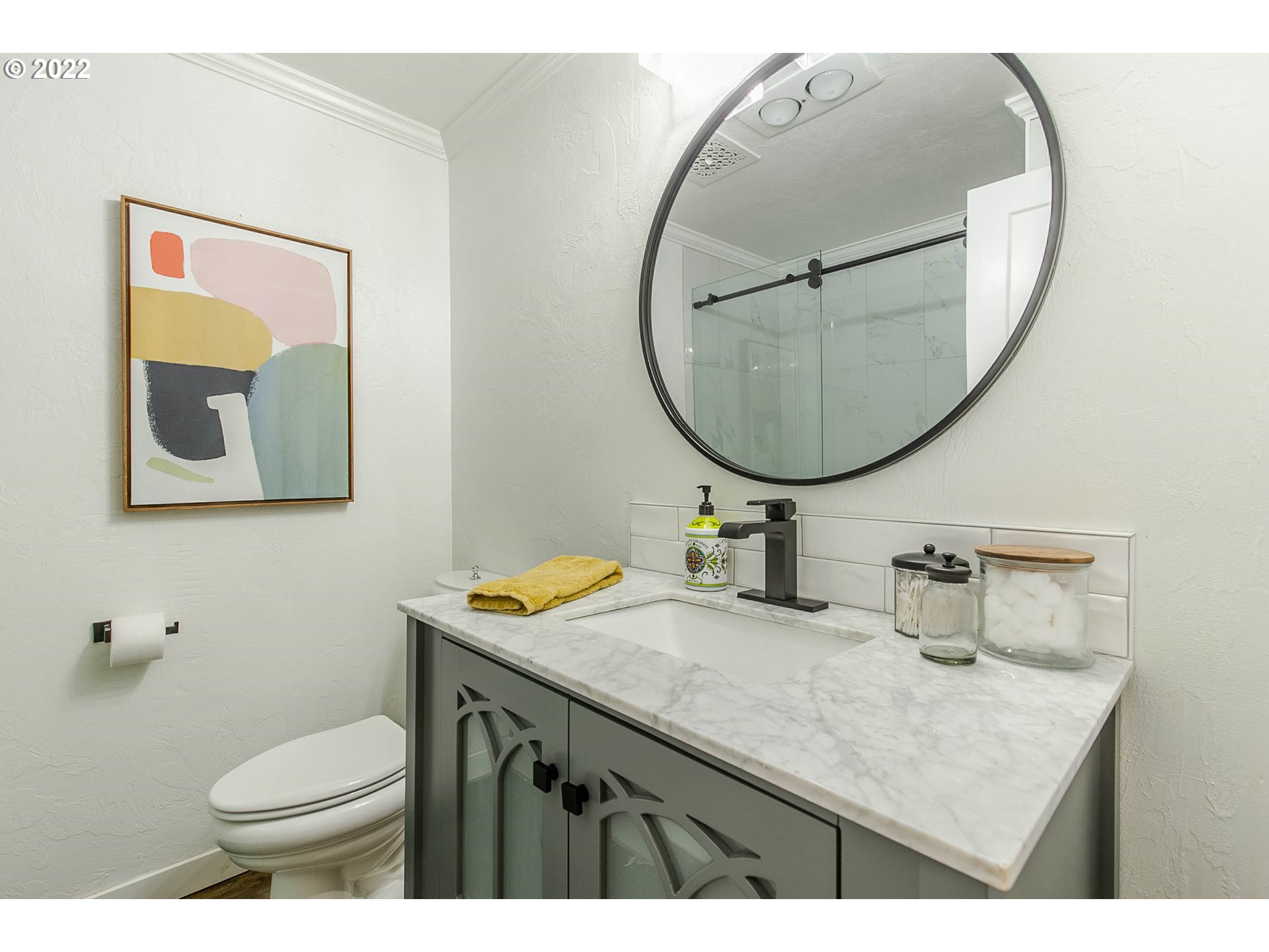 1597 Balboa Street Eugene, OR 97408 - Photo 12 of 27 a bathroom with a sink a mirror and a toilet