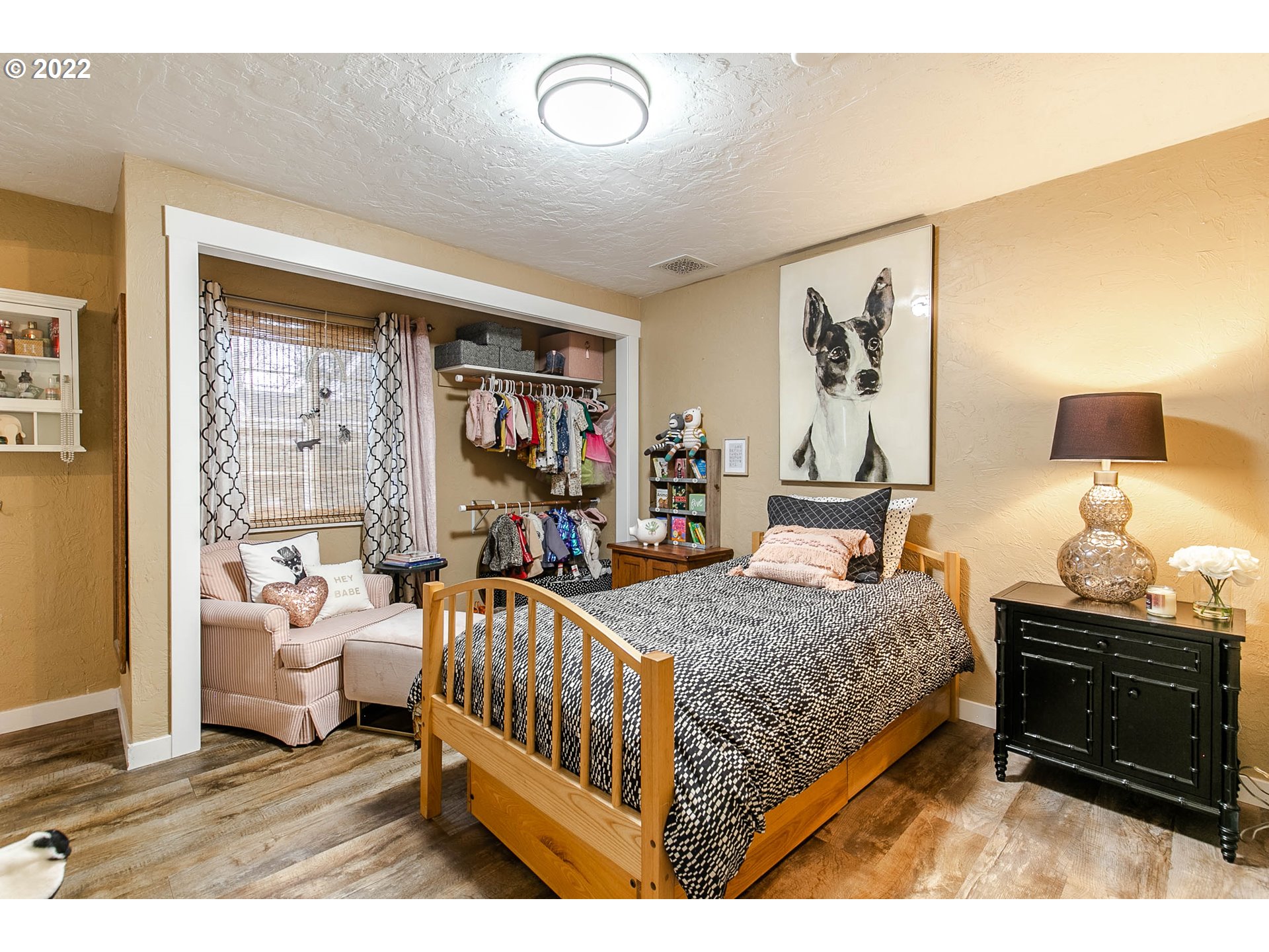 1597 Balboa Street Eugene, OR 97408 - Photo 13 of 27 a bedroom with a bed and wooden floor