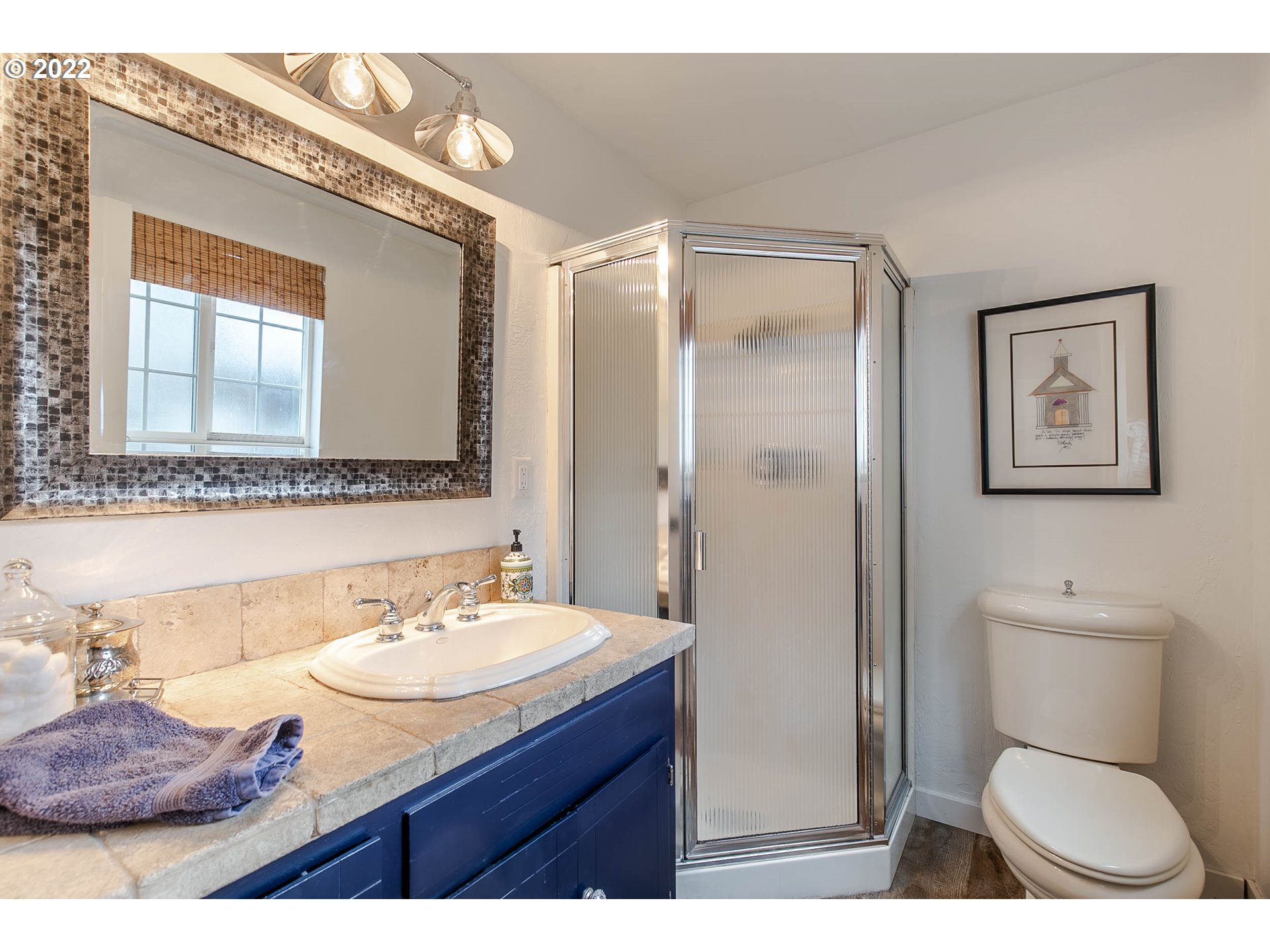 1597 Balboa Street Eugene, OR 97408 - Photo 14 of 27 a bathroom with a toilet sink and mirror