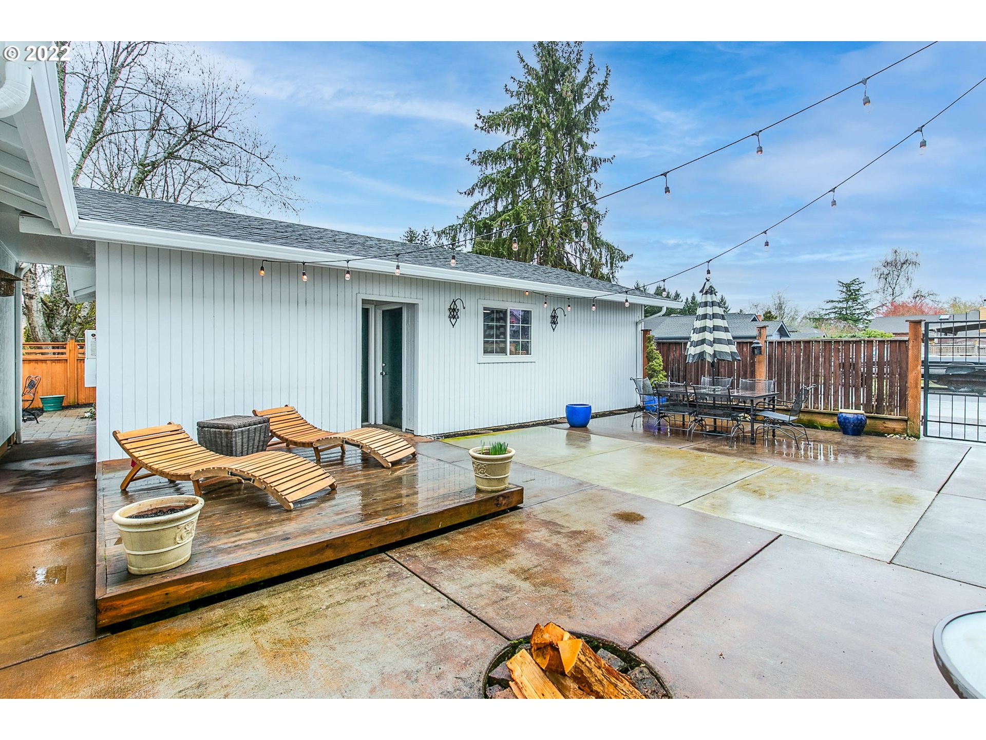 1597 Balboa Street Eugene, OR 97408 - Photo 22 of 27 a backyard of a house with barbeque oven table and chairs