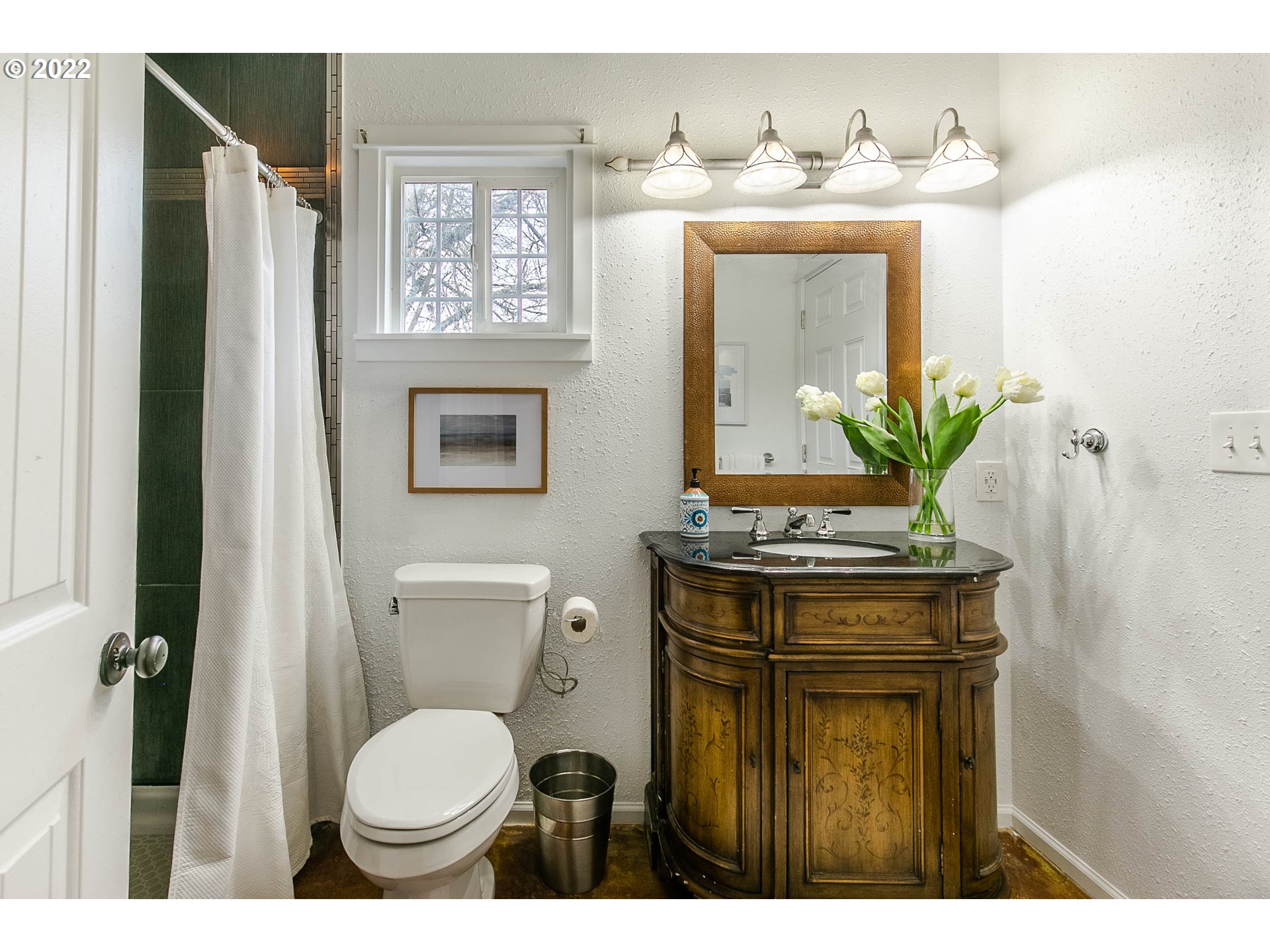 1597 Balboa Street Eugene, OR 97408 - Photo 27 of 27 a bathroom with a granite countertop sink and a mirror
