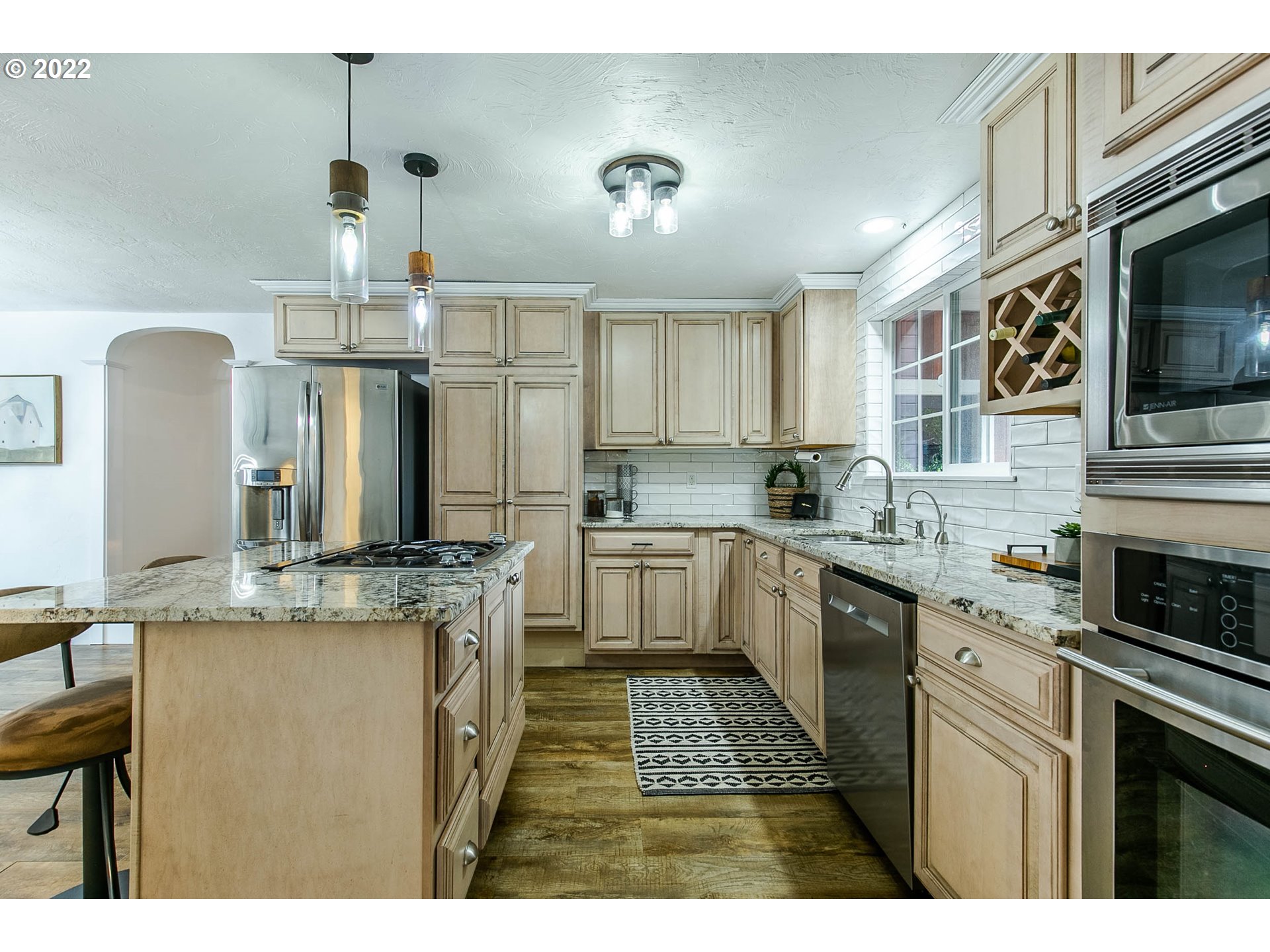 1597 Balboa Street Eugene, OR 97408 - Photo 4 of 27 a kitchen with stainless steel appliances granite countertop a sink stove and refrigerator