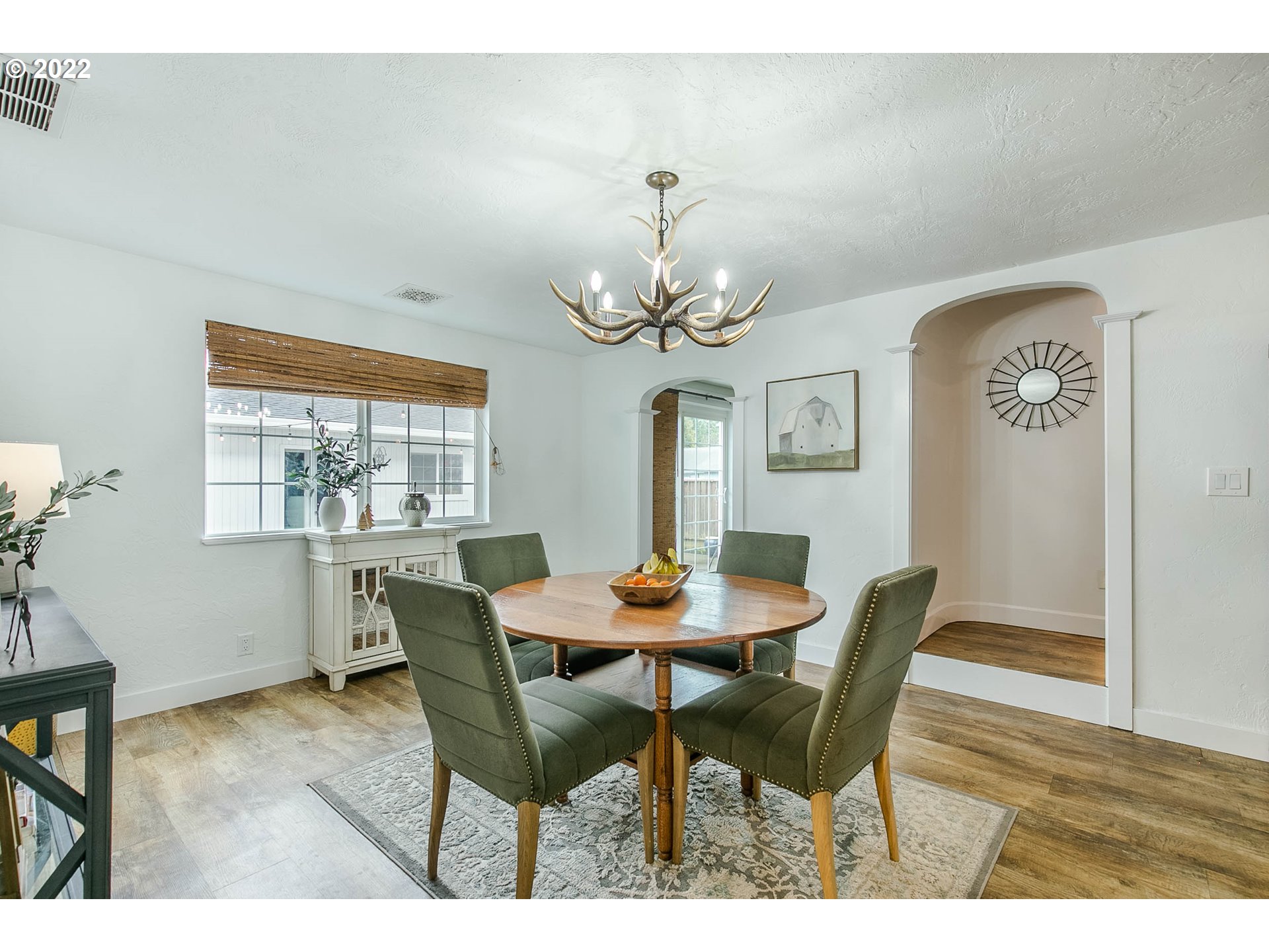 1597 Balboa Street Eugene, OR 97408 - Photo 6 of 27 a dining room with furniture a chandelier and wooden floor