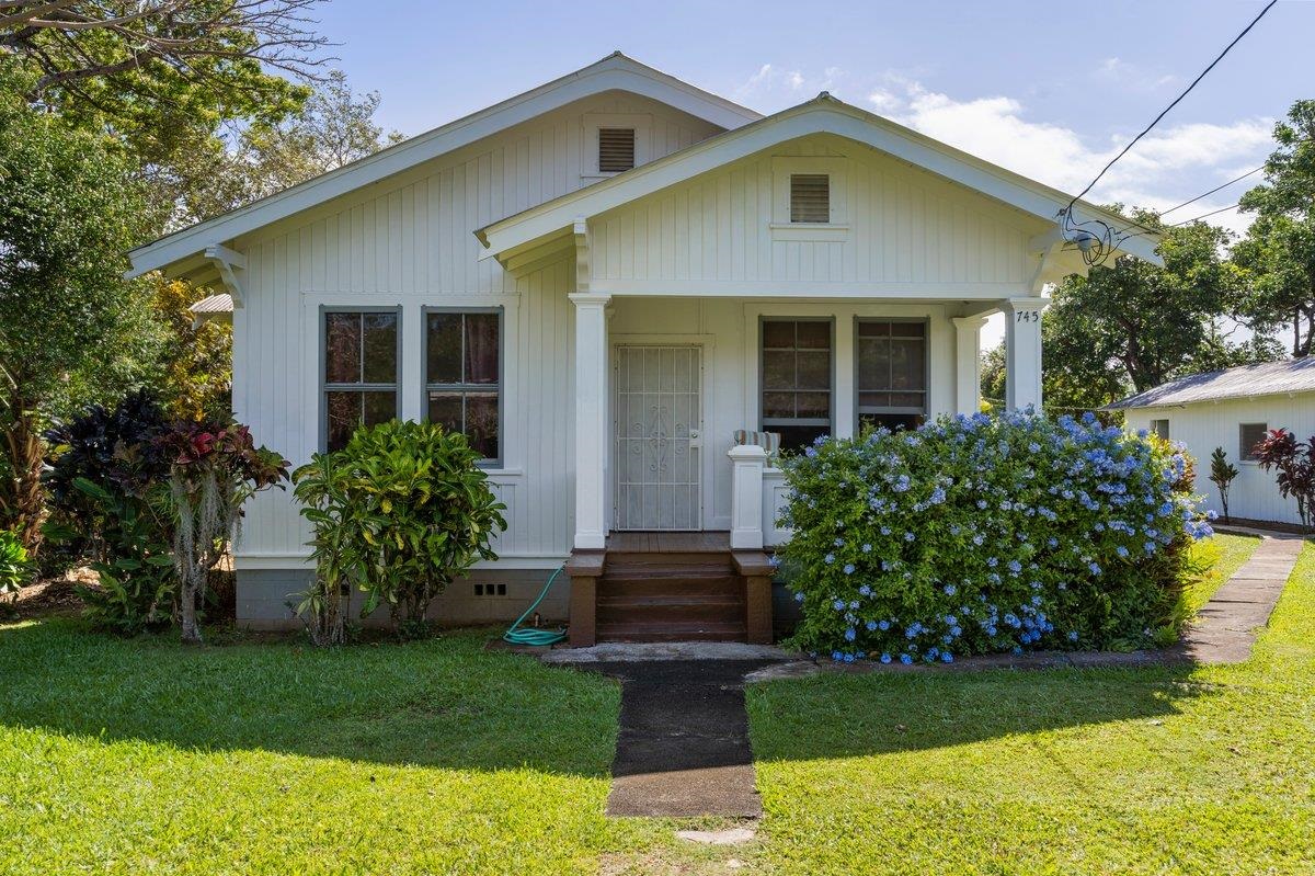 745 Kauhikoa Road Haiku, HI 96708 - Photo 1 of 8 a front view of a house with garden