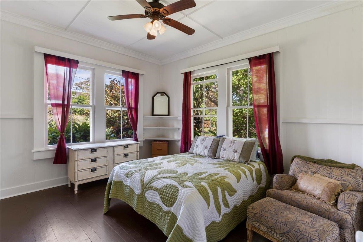 745 Kauhikoa Road Haiku, HI 96708 - Photo 6 of 8 a bedroom with a bed and a window
