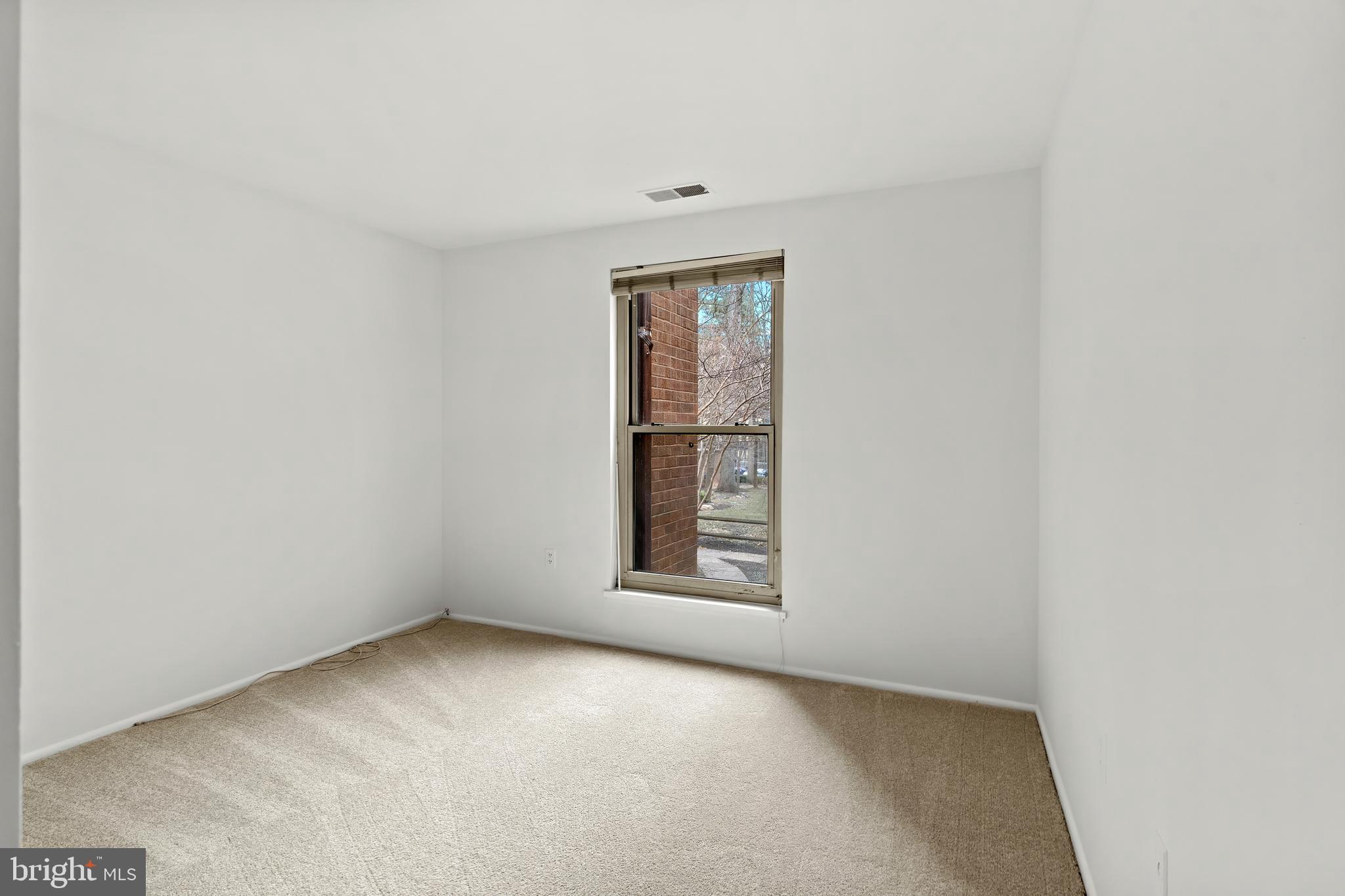 3362 Woodburn Road, Unit 13 Annandale, VA 22003 - Photo 12 of 17 an empty room with windows