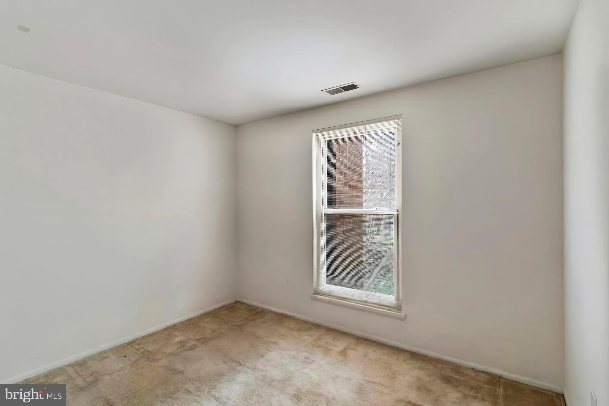 3362 Woodburn Road, Unit 13 Annandale, VA 22003 - Photo 14 of 19 an empty room with windows