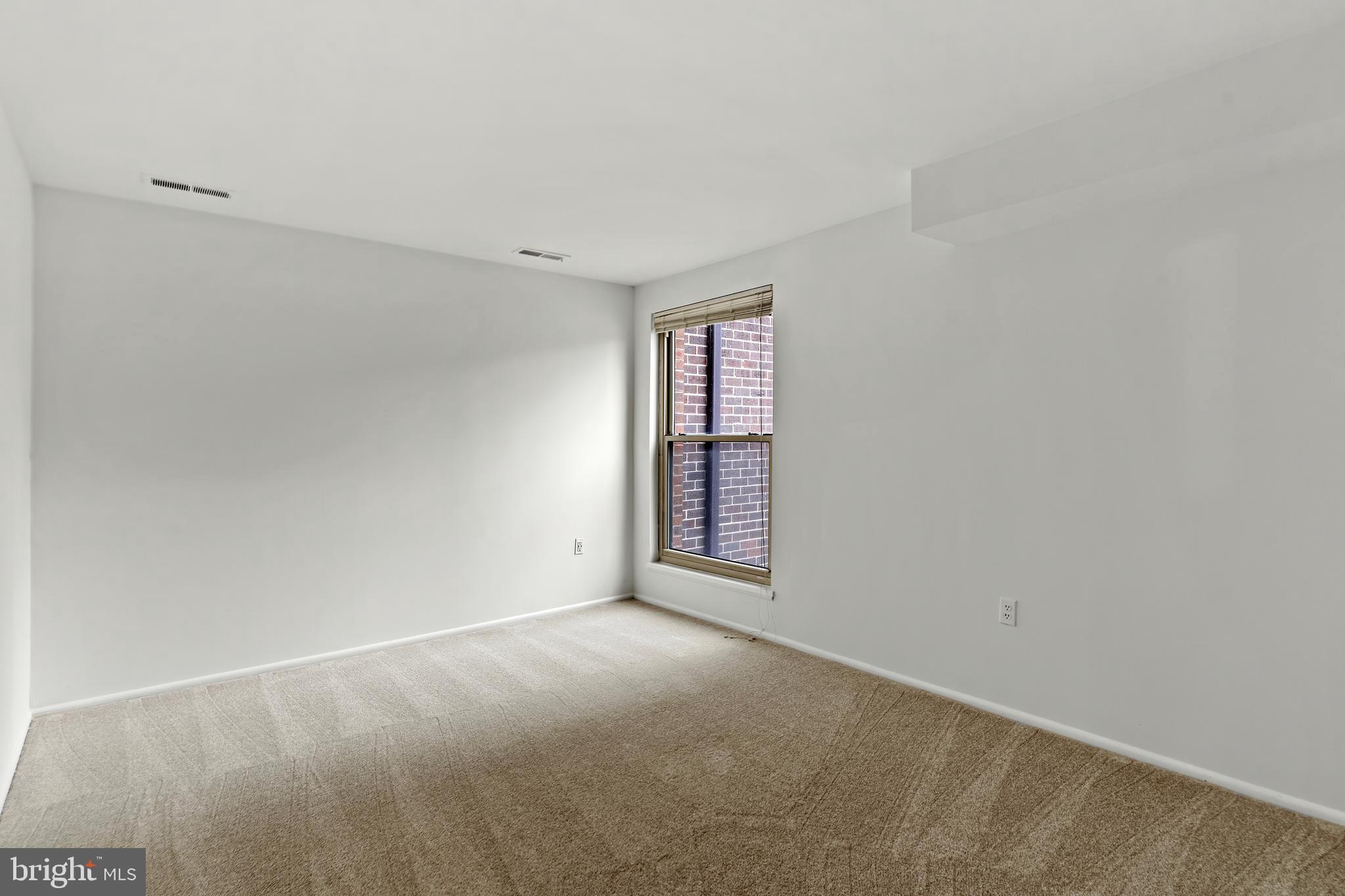 3362 Woodburn Road, Unit 13 Annandale, VA 22003 - Photo 14 of 17 a view of an empty room with a window