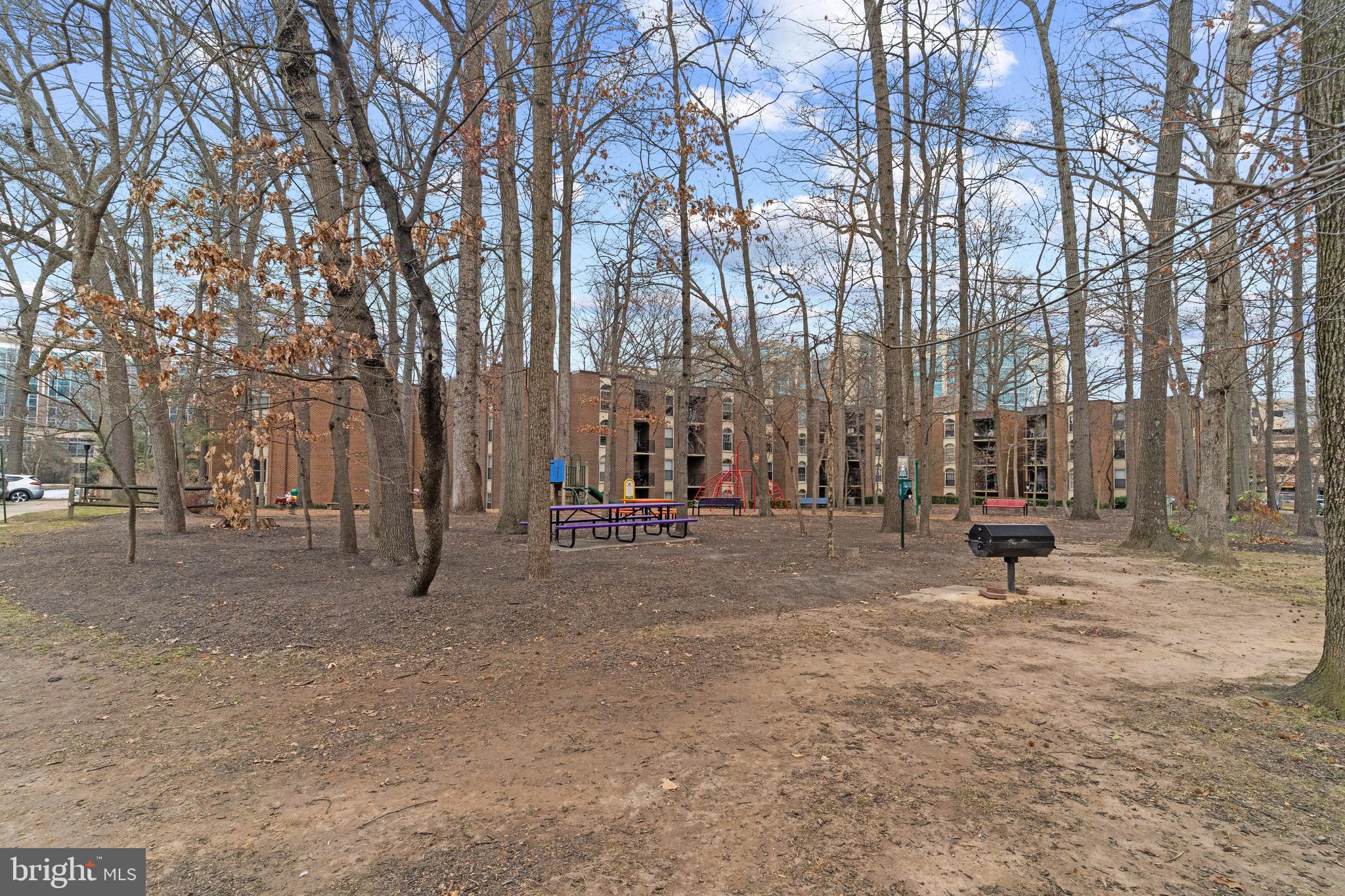 3362 Woodburn Road, Unit 13 Annandale, VA 22003 - Photo 18 of 19 a white bench sitting in middle of a yard