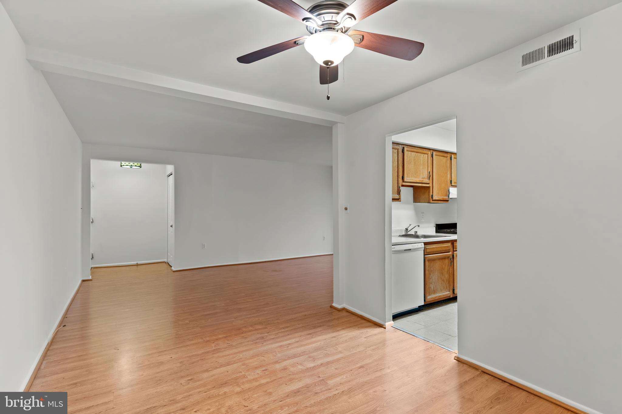 3362 Woodburn Road, Unit 13 Annandale, VA 22003 - Photo 4 of 17 a view of empty room with wooden floor and ceiling fan
