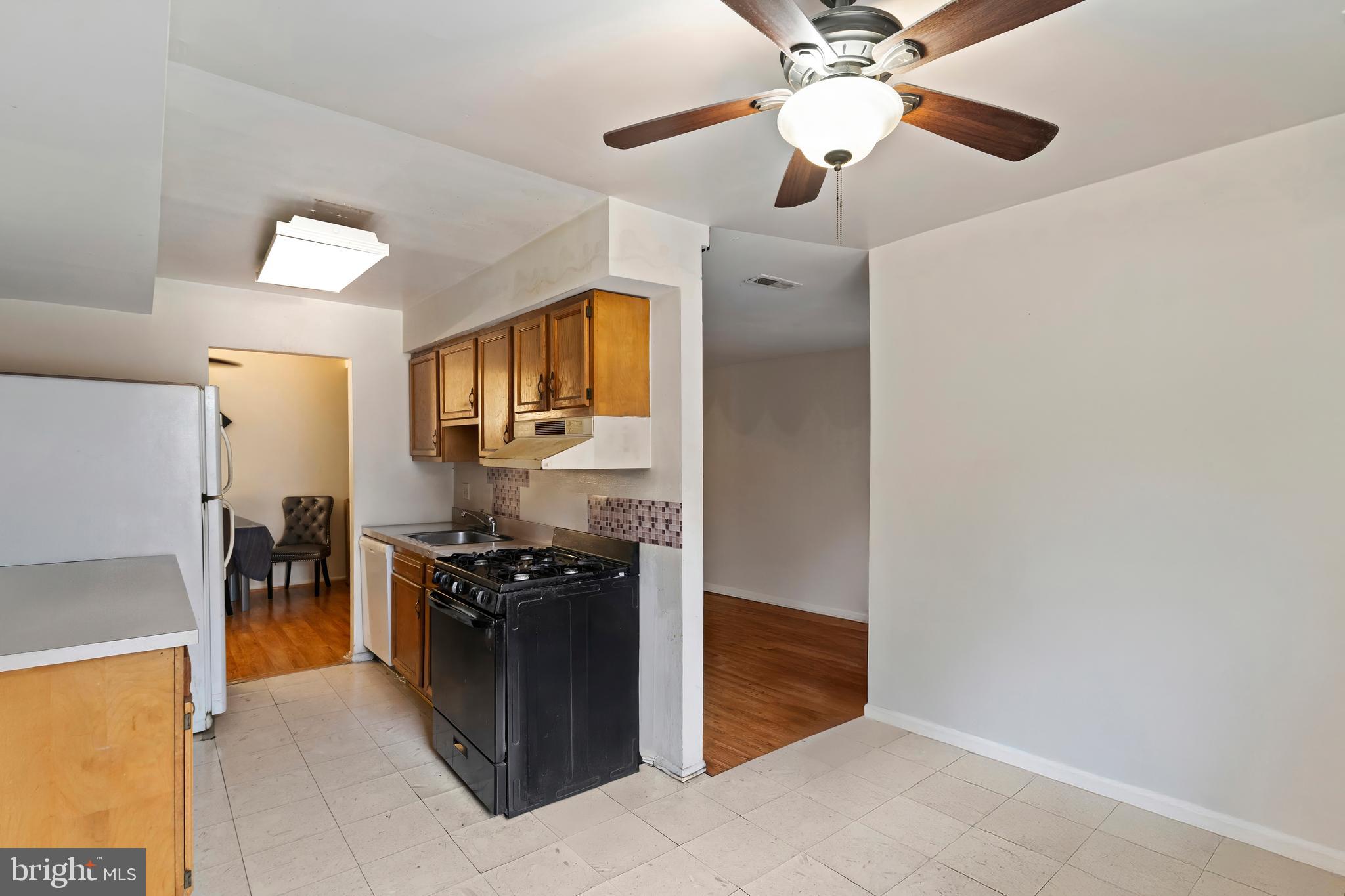 3362 Woodburn Road, Unit 13 Annandale, VA 22003 - Photo 9 of 19 a kitchen with stainless steel appliances granite countertop a refrigerator and a stove