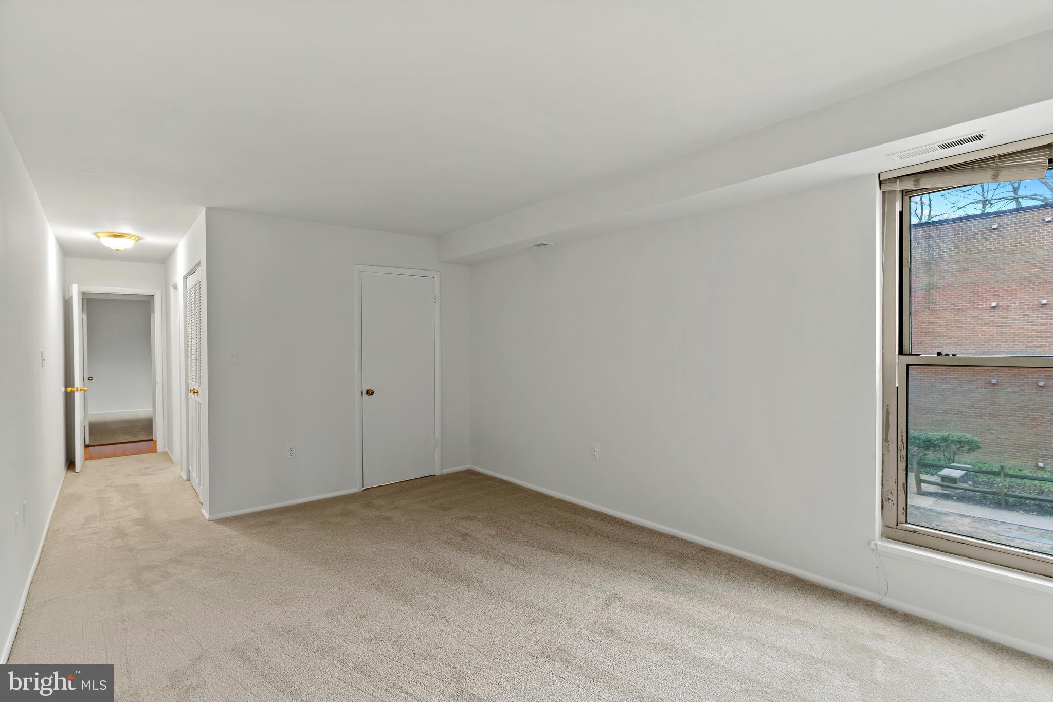3362 Woodburn Road, Unit 13 Annandale, VA 22003 - Photo 9 of 17 an empty room with a window