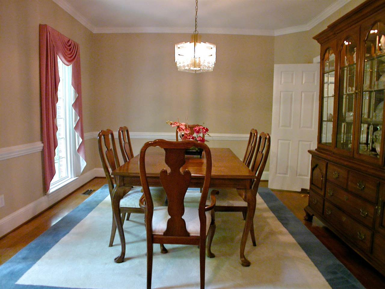 11812 Mountbatten Way Raleigh, NC 27613 - Photo 4 of 25 Dining Room with hardwood floors, chair rail & dentil molding. Formal Dining Room