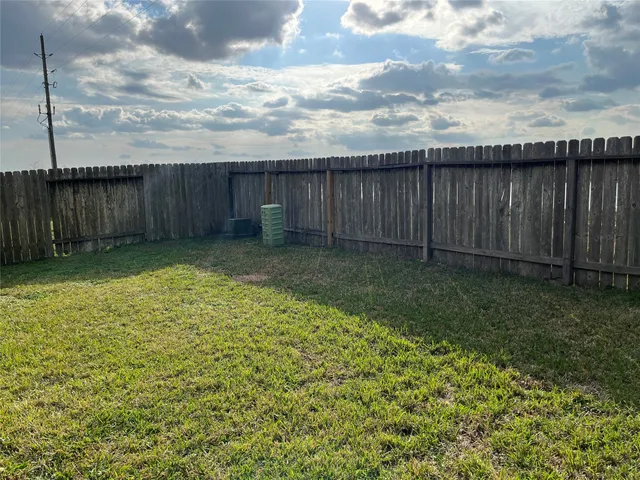 a view of a backyard of the house