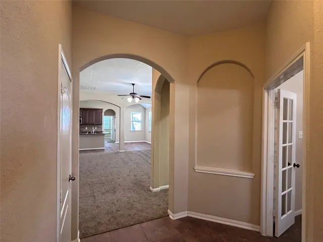 a view of livingroom with hardwood floor and hallway