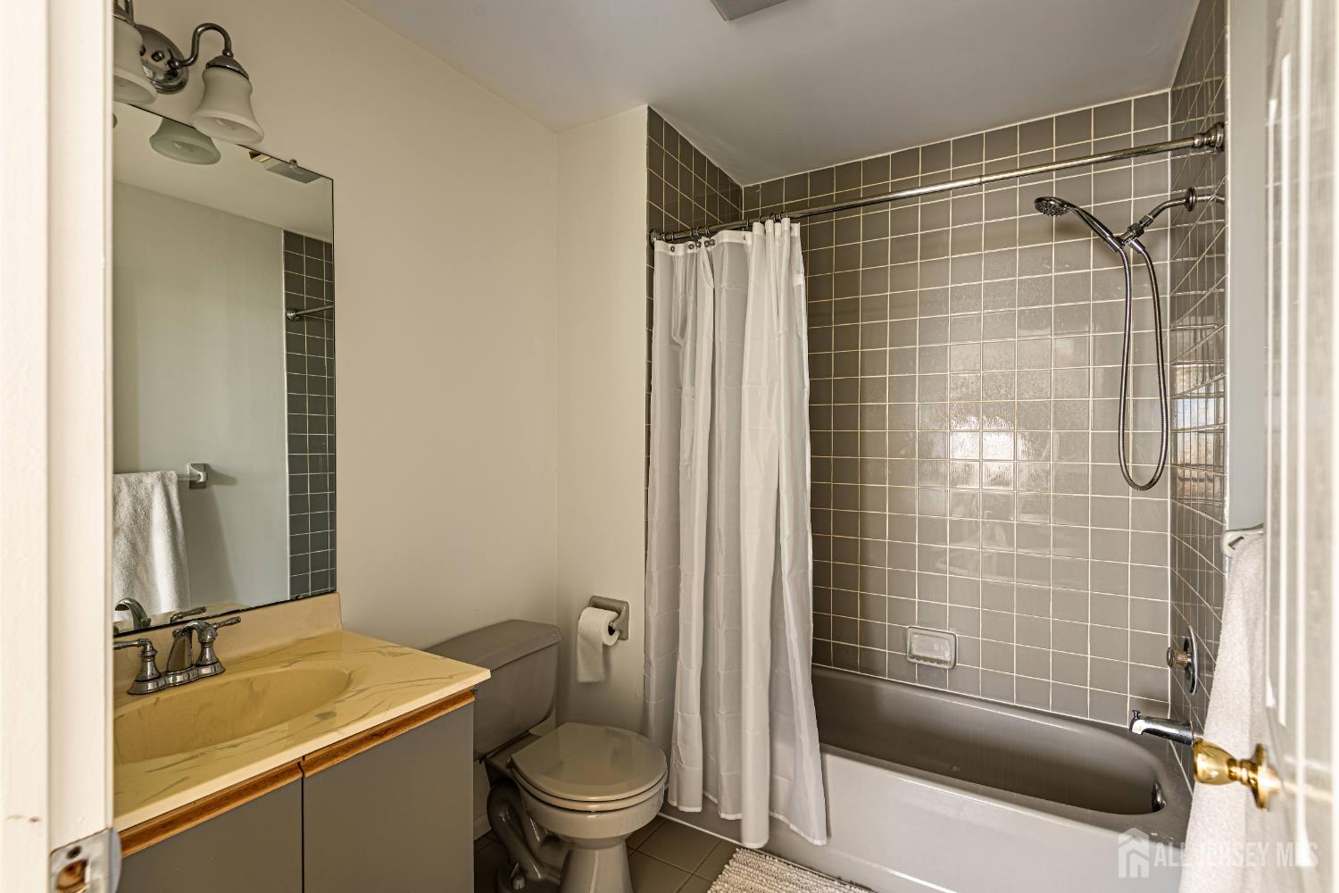328 Lunar Road Piscataway, NJ 08854 - Photo 8 of 18 a bathroom with a sink toilet and shower