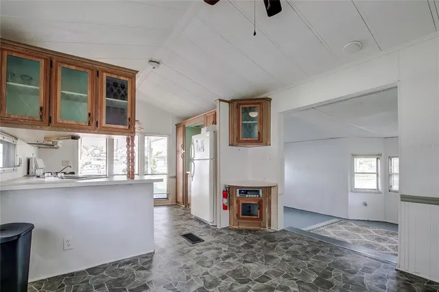 a view of a kitchen with furniture and windows