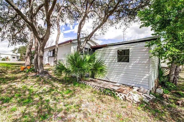 a view of a backyard of the house