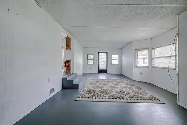 a view of an empty room and window