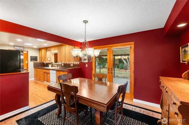 a view of a dining room with furniture window and outside view