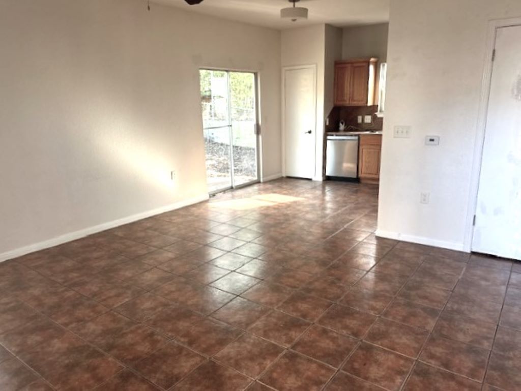 4704 Ledesma Road, Unit A & B Austin, TX 78721 - Photo 15 of 24 an empty room with kitchen view and a window