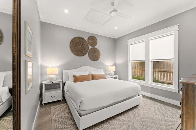 a bedroom with a large bed and a window