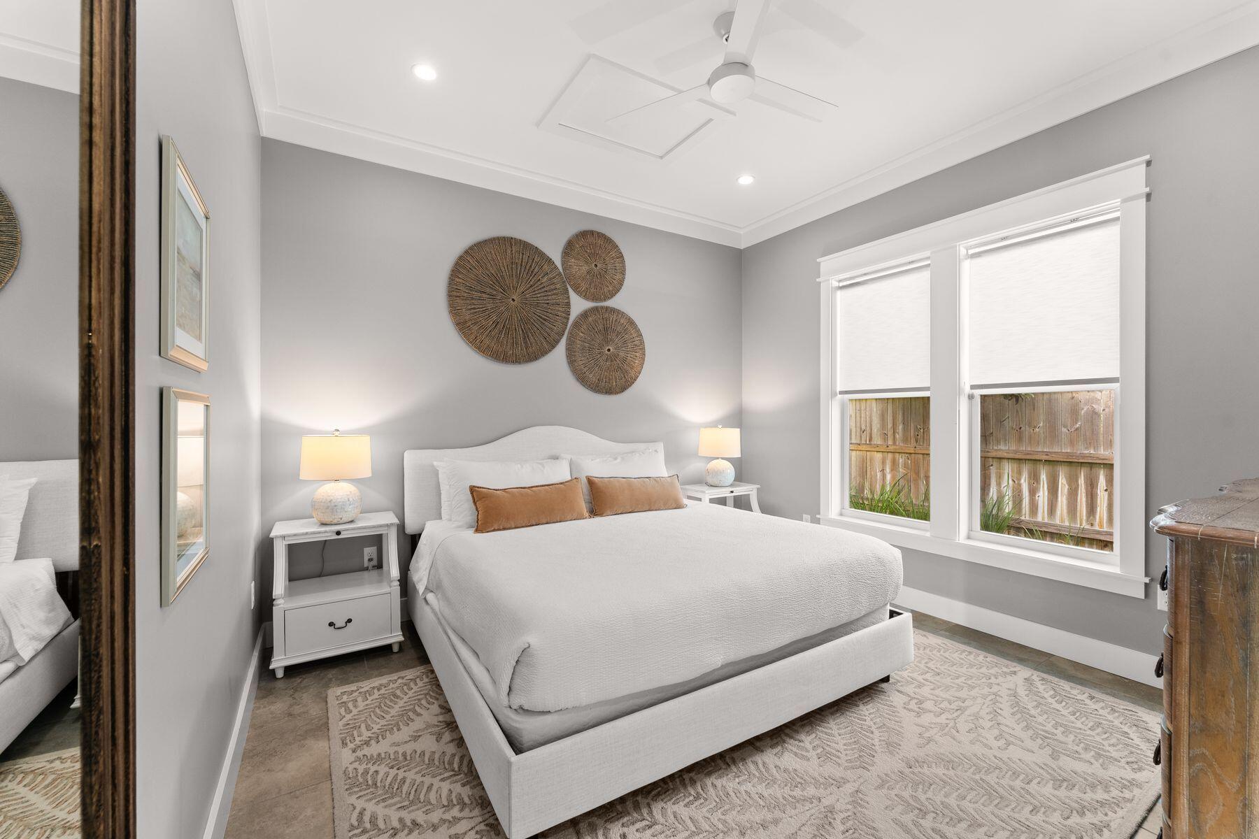 389 Seacrest Drive Seacrest, FL 32461 - Photo 13 of 33 a bedroom with a large bed and a window