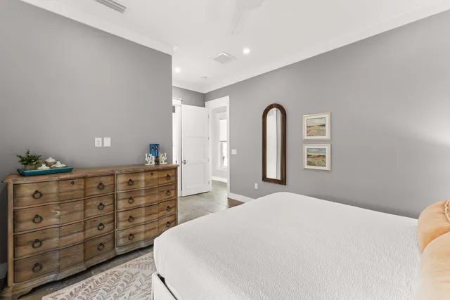 a bedroom with a bed and a dresser