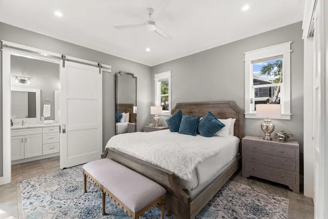 a bedroom with a large bed and a couch