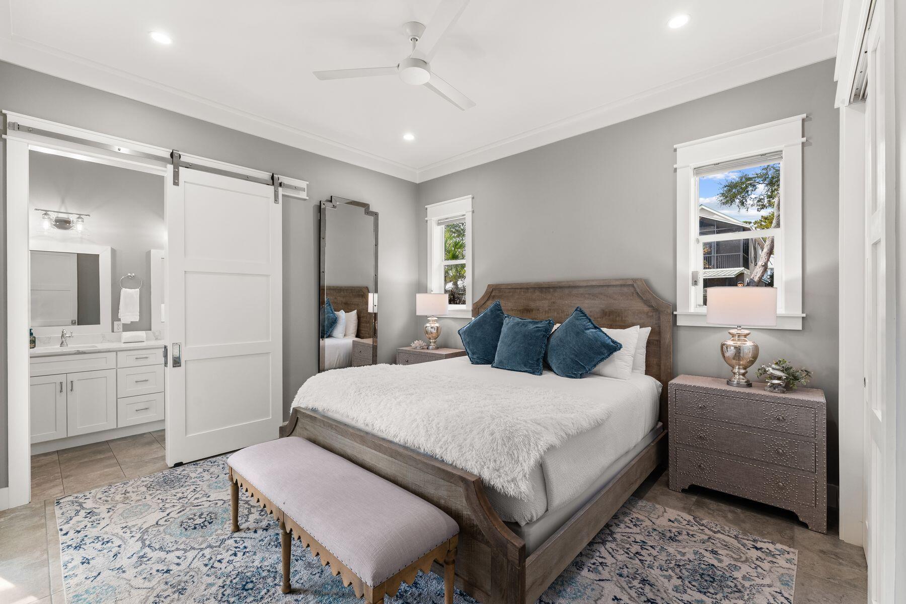 389 Seacrest Drive Seacrest, FL 32461 - Photo 17 of 33 a bedroom with a large bed and a couch