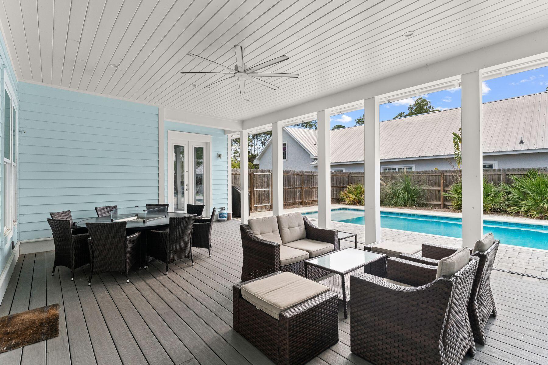 389 Seacrest Drive Seacrest, FL 32461 - Photo 19 of 33 a living room with furniture and large windows