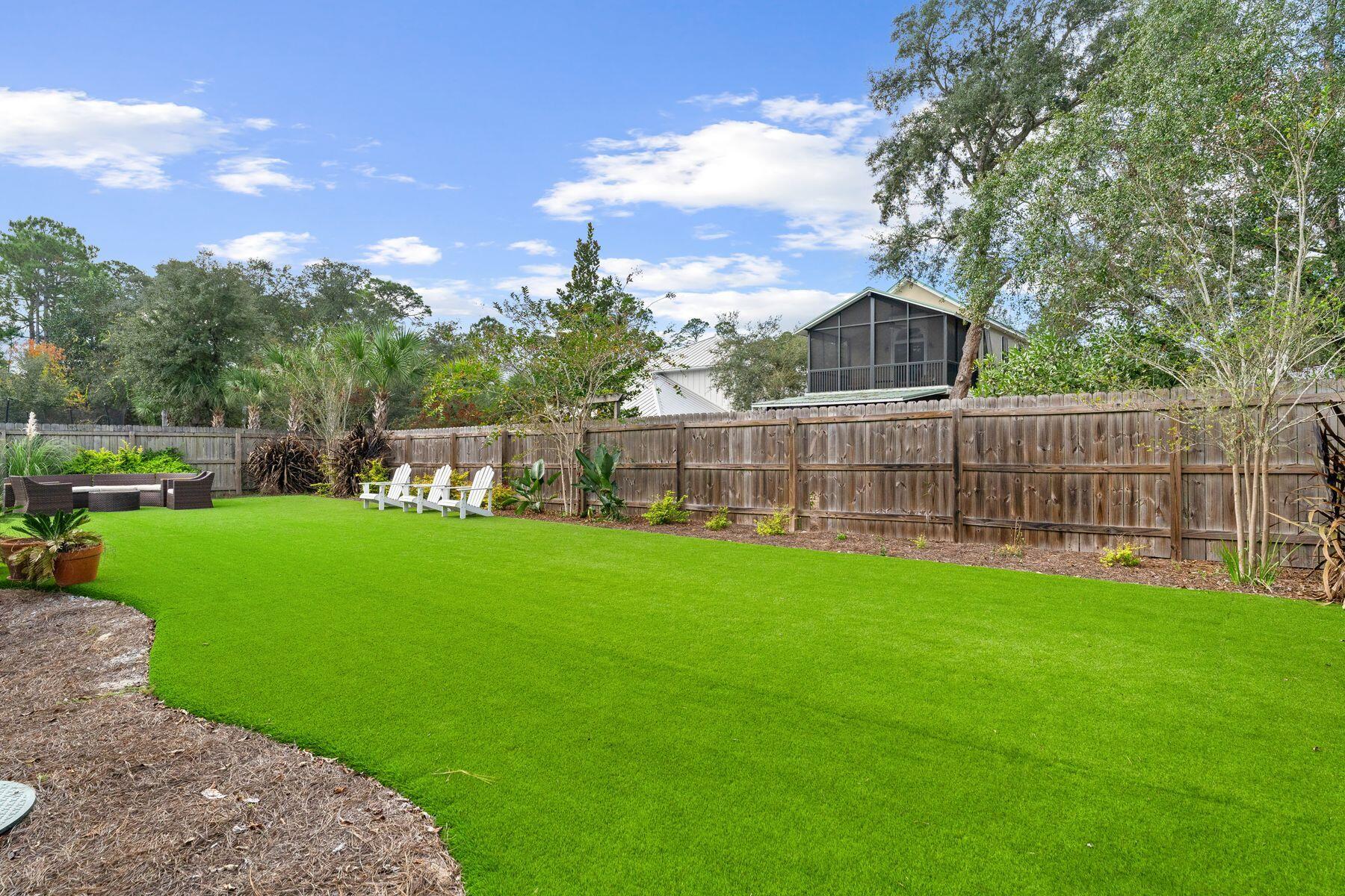 389 Seacrest Drive Seacrest, FL 32461 - Photo 24 of 33 a front view of a house with garden